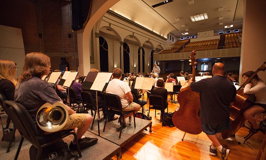 People rehearsing for a symphony concert